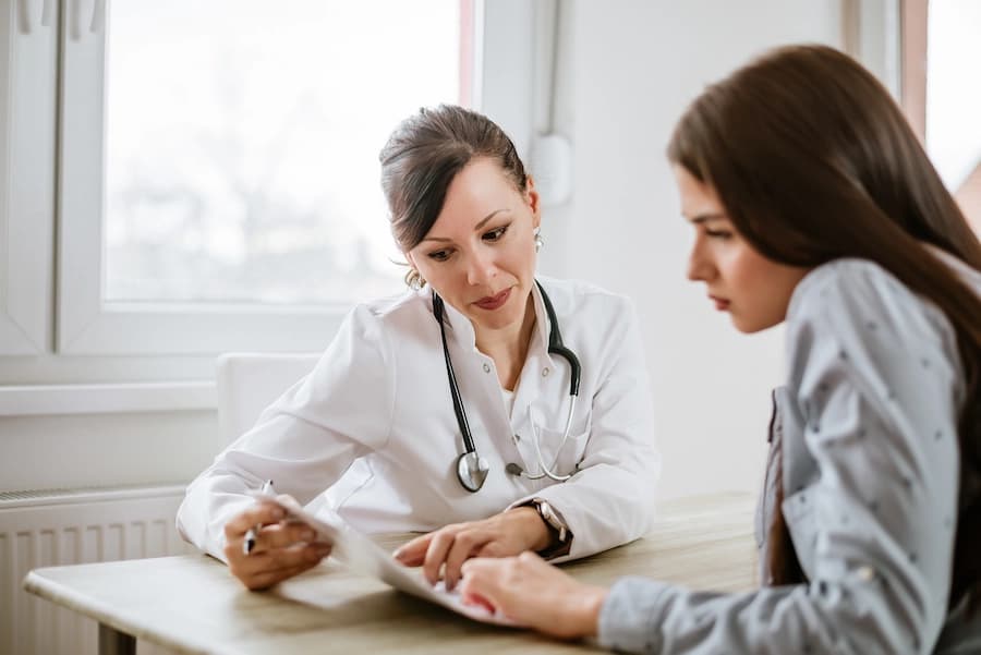 Doctor discussing a patient diagnosis of Central Nervous System Inflammatory Disease